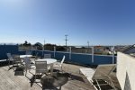 The rooftop deck is wind protected and features amazing ocean views